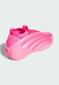 Bright pink athletic shoe with textured sole, pull tabs on tongue and heel, and molded side accents, shown from a side-back angle.
