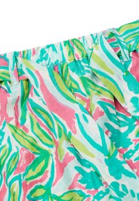 Tessuto a fantasia colorato con disegni di foglie rosa, turchese e verde, dotato di vita elasticizzata e texture leggera.