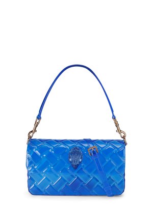 Blue quilted handbag with glossy finish, top handle, detachable strap, and a decorative jeweled clasp in the center.