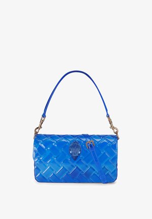 Blue quilted handbag with glossy finish, top handle, detachable strap, and a decorative jeweled clasp in the center.