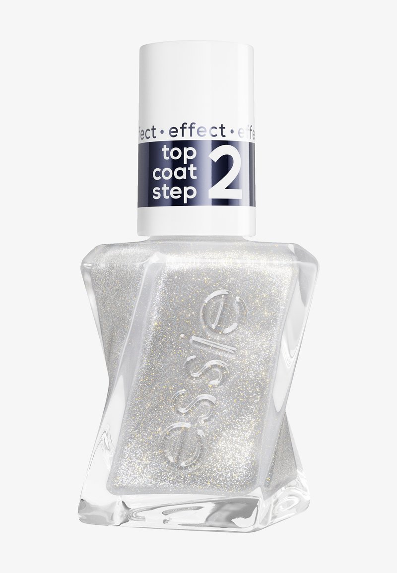 Gennemsigtig flaske med asymmetrisk form, der indeholder sølvglimmer neglelak. Hvid hætte med mærkat "top coat trin 2" i blå og sort tekst.