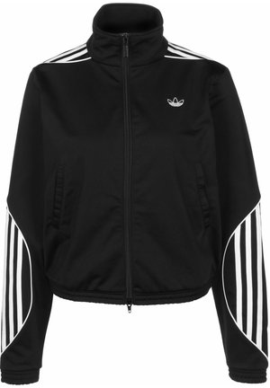 Veste de sport noire à fermeture éclair avec des bandes blanches sur les épaules et les manches, avec un petit logo Adidas sur la poitrine gauche.