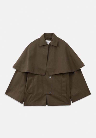Brown, boxy jacket with a collar and a cape-like overlay. Features two front pockets and snap closures for fastening. Structured cotton material.