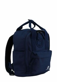 Navy blue fabric backpack with adjustable straps, top handle, zip closure, front pocket, and embossed logo detail on the side.