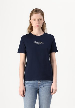 T-shirt en coton bleu marine à manches courtes et col rond, arborant un imprimé logo blanc sur la poitrine et une coupe décontractée.
