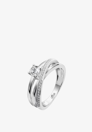 Silver ring featuring a round central diamond with two intertwining bands; one accented with small inset diamonds for added sparkle.