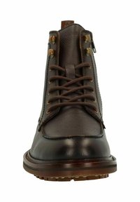 Bruine leren enkelboots met veters en rits, ronde neus, gestructureerd bovendeel en leren accenten op een stevige rubberen zool.