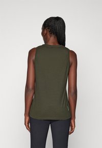 Dark green sleeveless top made from soft fabric, featuring a round neckline and a straight cut, with a small logo detail at the hem.