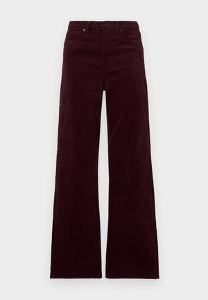 Bordo krāsas kordurova platās bikses ar augstu vidukli, aprīkotas ar rāvējslēdzēju, pogu aizdari un sānu kabatām. Gluda tekstūra ar vertikālām ribām.