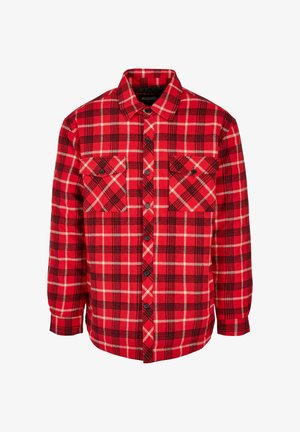 Punase ja musta ruudulise flanellist särgi, millel on kaks rinnataskut, nööbitav eesmine osa, pikad varrukad ja struktureeritud krae. Puuvillasegune kangas.