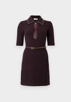Dark purple dress with short sleeves, textured fabric, collar, and a central zipper. Features a matching belt with a gold buckle.