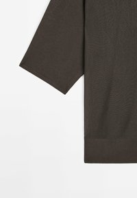 Dark brown knit pullover with a loose fit, featuring three-quarter sleeves and a ribbed hem. The texture is soft with a slightly heathered appearance.
