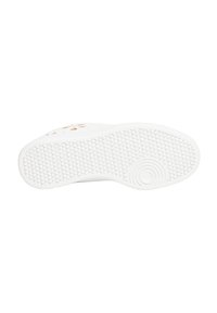 Suola di una sneaker bianca con gomma testurizzata per una maggiore aderenza, caratterizzata da un design circolare nell'area del tallone e piccoli motivi circolari in tutto il resto.