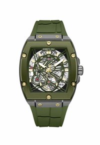 Kenneth Cole Uhr mit grünem Gummiband und einem rechteckigen Gehäuse aus Edelstahl, ausgestattet mit einem Skelett-Zifferblatt mit goldenen Akzenten und sichtbaren Zahnrädern.