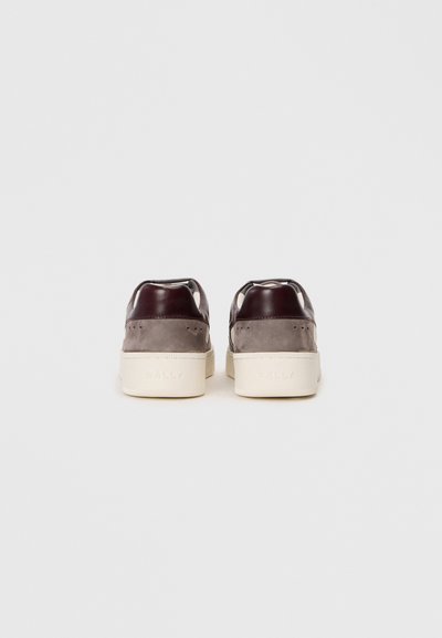 Sneakers featuring a dark burgundy leather upper with gray suede accents, a white rubber sole, and branding embossed on the heel counter.