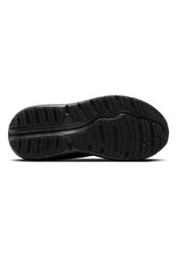 Zwarte hardloopschoen zool met textuur rubber voor grip; beschikt over groeven en richels voor tractie; logo zichtbaar aan de buitenkant.