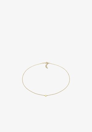 Collier délicat en chaîne d'or avec un petit pendentif en forme de cœur et un fermoir ajustable sur fond blanc.