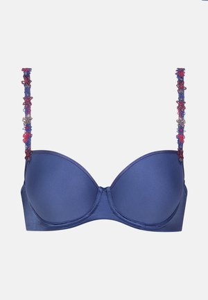 Navy blue padded bra with floral lace accents on the straps, smooth texture, and underwire support for a structured fit.