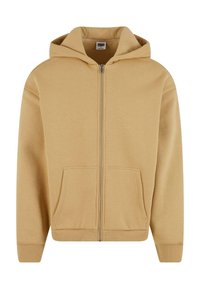 Beige Kapuzenpullover mit Reißverschluss aus weichem Stoff, mit Tunnelzugkapuze, zwei Fronttaschen sowie gerippten Bündchen und Saum.