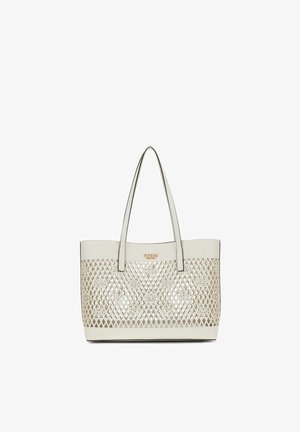 Sac fourre-tout couleur crème avec doubles anses et motif en treillis ajouré présentant des motifs floraux et un petit logo de marque doré.
