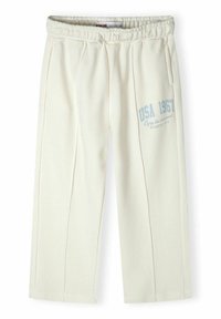 Light beige sweatpants with an elastic waistband, side pockets, and a printed "USA 1967" design in blue on the left leg.