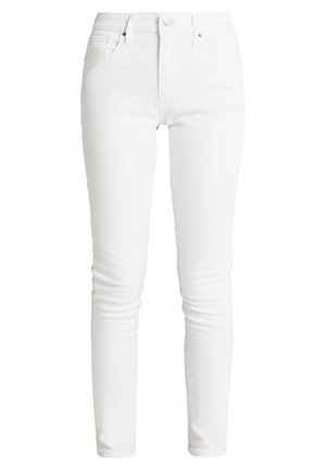 Jeans skinny in denim bianco con design a cinque tasche, chiusura con bottone e passanti per cintura. Texture liscia con dettagli di cucitura minimi.