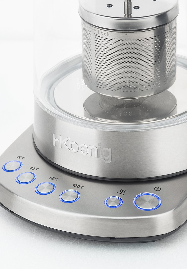 Elektrischer Wasserkocher mit gläsernem Gehäuse, Edelstahlbasis und perforiertem Teefilter. Verfügt über blau beleuchtete Tasten zur Temperatureinstellung.