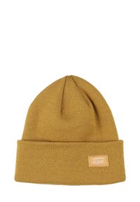 Béret en tricot jaune moutarde avec un revers, fabriqué en matériau doux. Présente une petite étiquette rectangulaire en cuir avec le logo "Oxbow".