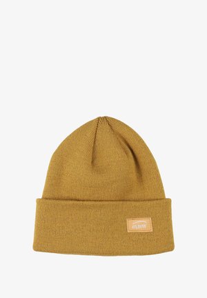 Béret en tricot jaune moutarde avec un revers, fabriqué en matériau doux. Présente une petite étiquette rectangulaire en cuir avec le logo "Oxbow".