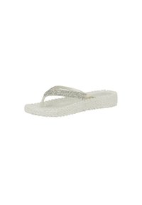 Infradito bianche con una suola tessuta texturizzata, dotate di una fascia trasparente decorata con scintillanti strass e un plantare liscio.