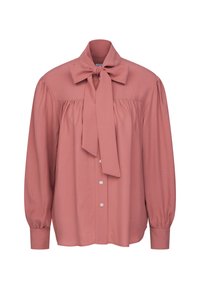 Blusa color rosa con colletto a fiocco, maniche lunghe a sbuffo, chiusura frontale con bottoni e dettagli arricciati sulle spalle. Tessuto in superficie liscia.