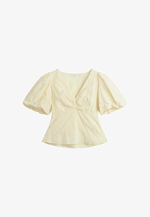 Cremefarvet bluse med korte pufærmer, V-udskæring, rynket foran og diskret blomstermønster.