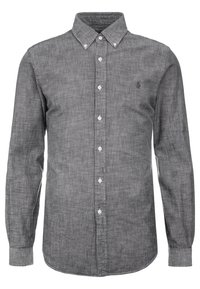 Camicia grigia con bottoni realizzata in un tessuto testurizzato, caratterizzata da un colletto classico, maniche lunghe e bottoni bianchi; piccolo logo sul lato sinistro del petto.