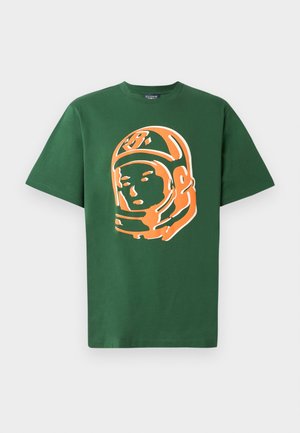 Green cotton t-shirt featuring a large orange astronaut graphic on the front, with short sleeves and a relaxed fit.