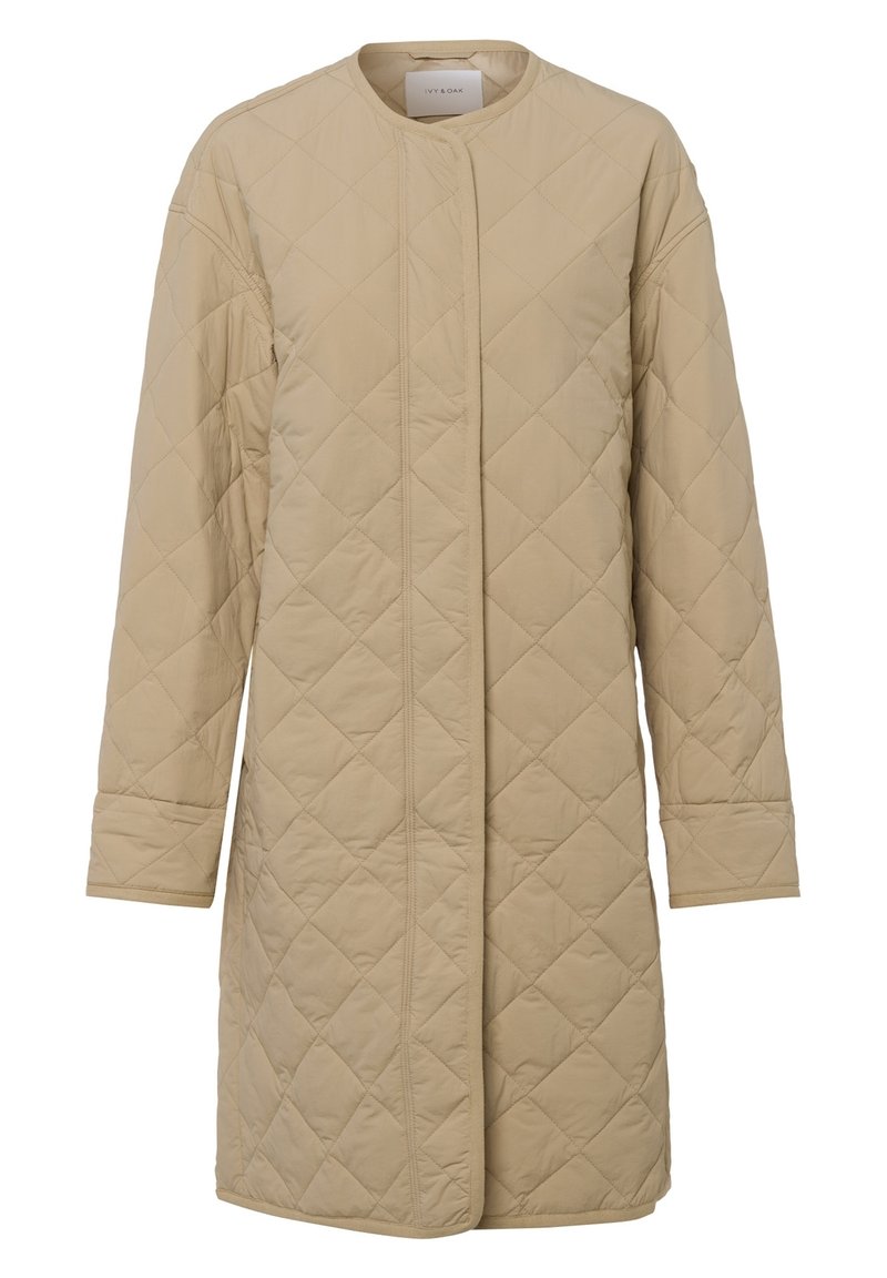 Quilted beige long coat with a round neckline, front snap closure, and long sleeves. Features diamond patterns and a smooth texture.