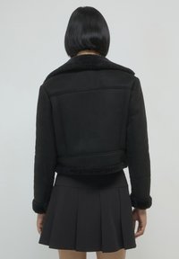 Calliope MONTONE  - Giacca in similpelle - nero