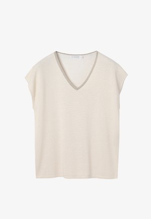 V-nyakú, rövid ujjú felső világos bézs színben, finom fényű. A nyakkivágás kontrasztos ezüst szegéllyel díszített. Puha, texturált anyag.