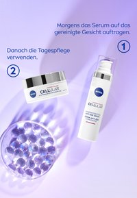 Two NIVEA skincare products on a purple background: a white serum bottle with a pump and a cream jar with a silver lid, surrounded by translucent beads.