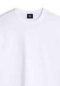 Witte katoenen T-shirt met ronde halslijn. Voorzien van een zwart label op de kraag, gelabeld "VANS", maat medium. Glad textuur, klassieke pasvorm.