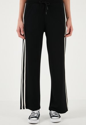 REGULAR FIT - Tracksuit bottoms - black