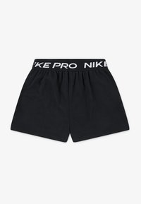 Shorts de sport noirs en tissu doux, avec une taille élastique portant l'inscription "NIKE PRO" en lettres blanches. Design simple et épuré.
