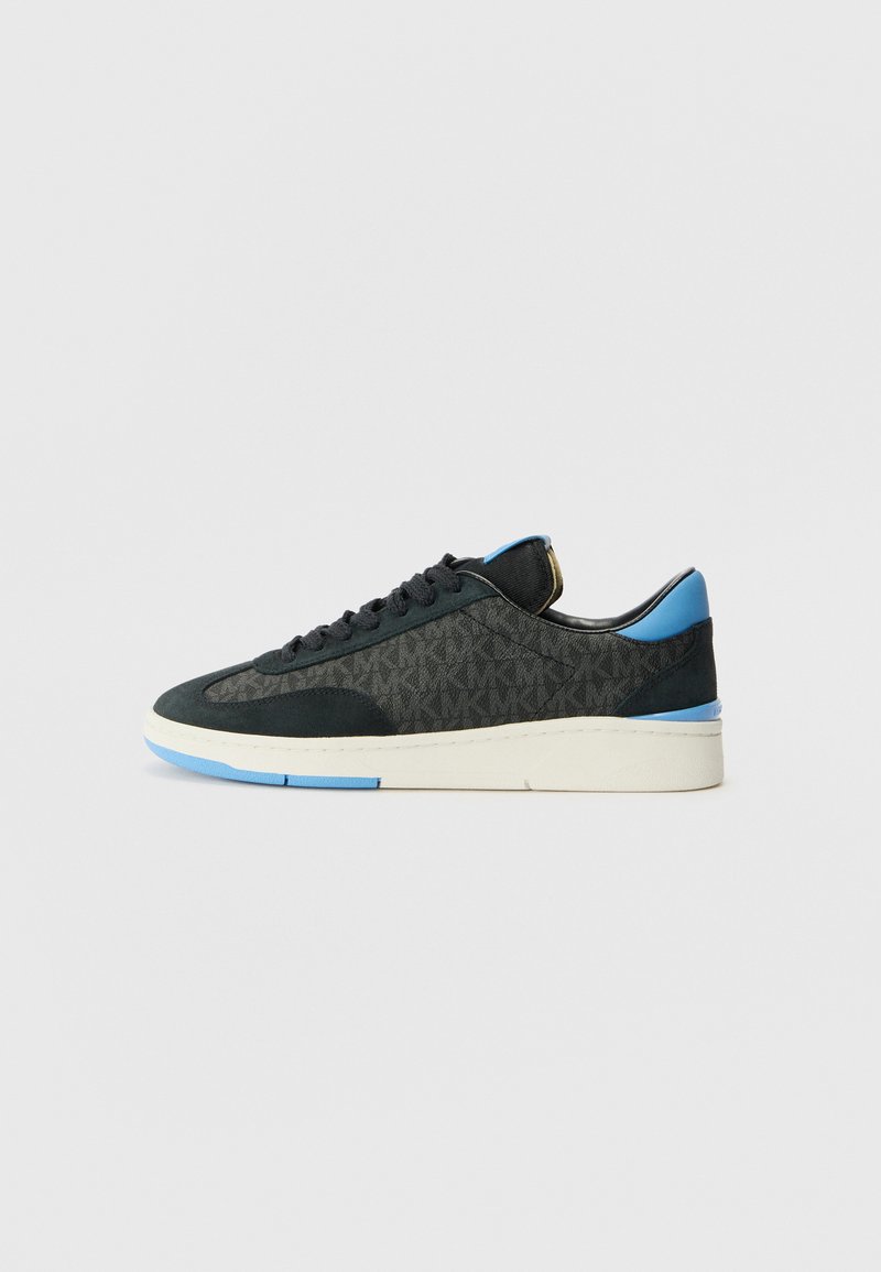 Black sneaker with patterned fabric, blue accents on the heel and tongue, white sole, round toe, and black laces.