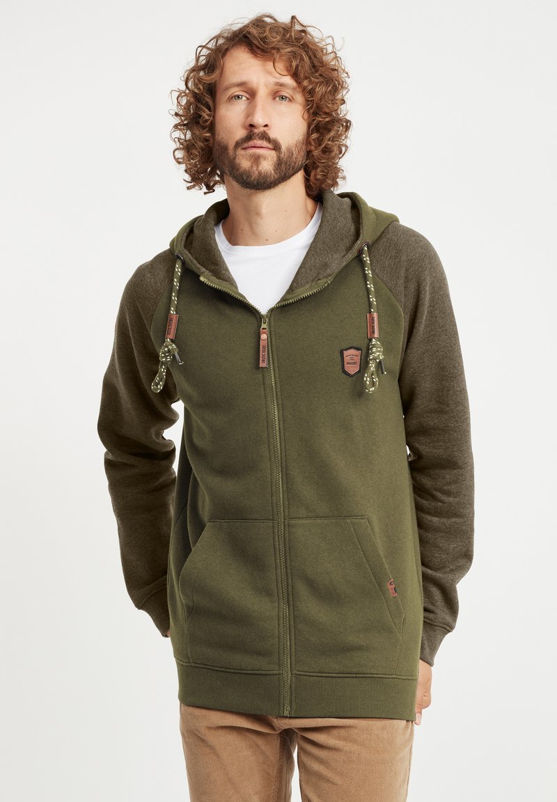 Green zip-up hoodie with contrasting gray sleeves, adjustable drawstring, two front pockets, and a logo patch on the chest.