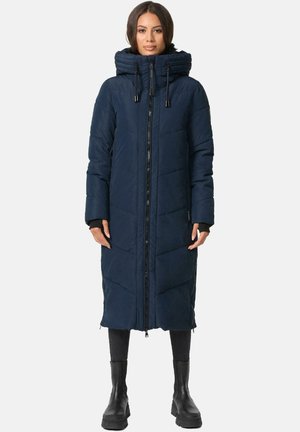 Long navy puffer coat with diamond quilting, high collar, and adjustable drawstring hood. Features a front zipper and side pockets.
