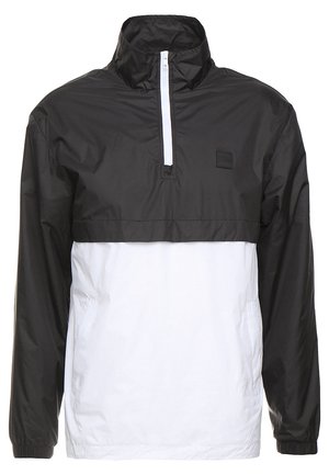 Fekete-fehér pulóverdzseki negyed zipzárral, magas gallérral és rugalmas mandzsettákkal. Könnyű, vízálló anyagból készült.