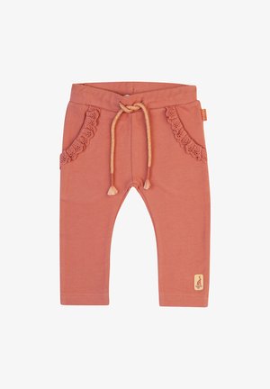 Light coral cotton pants with a drawstring waist, lace-trimmed pockets, and a small emblem at the hem. Smooth texture and fitted shape.