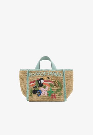 Sac fourre-tout en paille tressée avec poignées turquoise, broderie florale, feuilles vertes et détail texte sur le panneau avant.