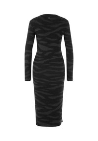 Long-sleeve black knit dress with dark gray wave pattern, form-fitting silhouette, crew neck, and side slit detail.