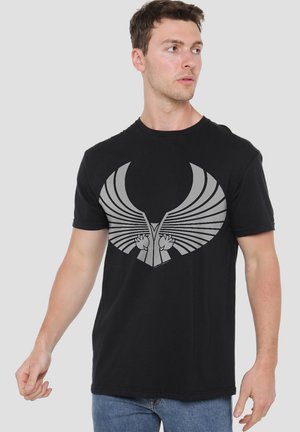 Black cotton t-shirt featuring a prominent gray wing graphic design at the chest, short sleeves, and a crew neckline.