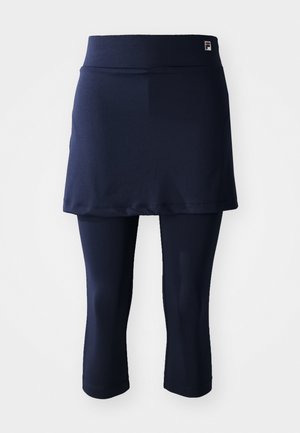 Gonna sportiva navy con leggings capri aderenti. Realizzata in tessuto morbido, presenta una vita ampia e un piccolo logo sulla vita.